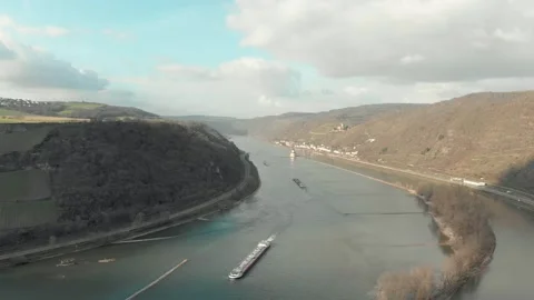 Aerial View Of River With Moving Barges, Trains, And Clouds Above. Video stock 297918266