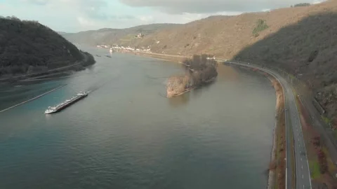 Aerial View Of River With Moving Barges, Trains, And Clouds Above. Video stock 297918510