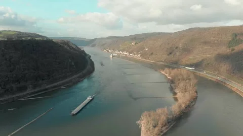 Aerial View Of River With Moving Barges, Trains, And Clouds Above. Video stock 297918564