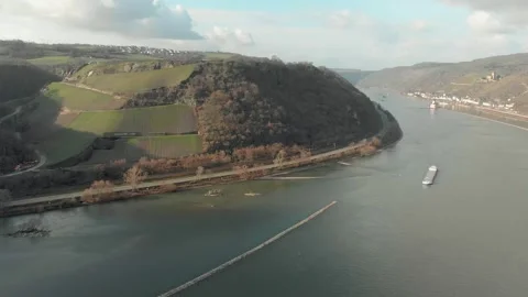 Aerial View Of River With Moving Barges, Trains, And Clouds Above. Video stock 297919089