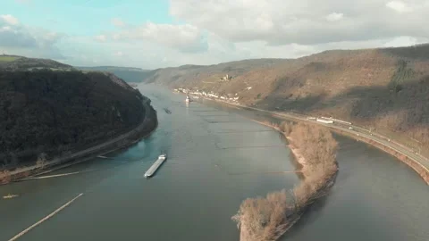 Aerial View Of River With Moving Barges, Trains, And Clouds Above. Video stock 297919090
