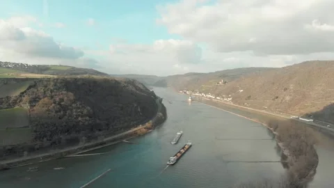 Aerial View Of River With Moving Barges, Trains, And Clouds Above. Video stock 297919179