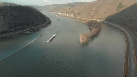Aerial View Of River With Moving Barges, Trains, And Clouds Above. Video stock 297919498