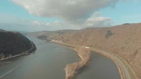 Aerial View Of River With Moving Barges, Trains, And Clouds Above. Video stock 297920913