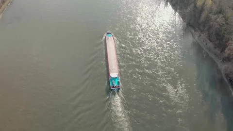 Aerial View Of A River With Moving Barges And Detailed Barge Close-Up. Video stock 297921120