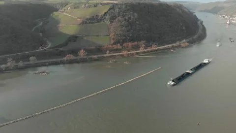 Aerial View Of River With Moving Barges, Trains, And Clouds Above. Video stock 297921244
