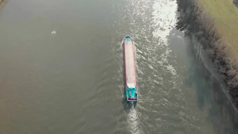 Aerial View Of A River With Moving Barges And Detailed Barge Close-Up. Stock Footage 297922525