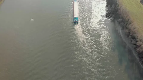 Aerial View Of A River With Moving Barges And Detailed Barge Close-Up. Stock Footage 297922653