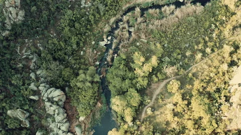Aerial view of a river nestled between rocks. Stock Footage 149011756