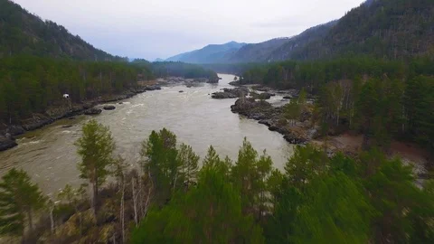 Aerial view of the river with a rock and forest in the middle Stock Footage 92604792