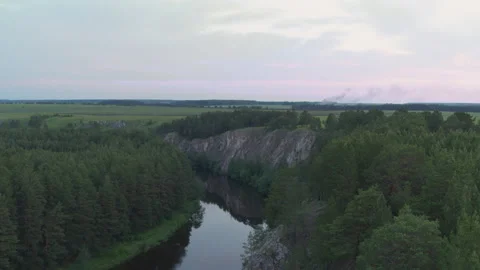 Aerial view of the river with a rock and forest on the banks Stock-Footage 139112968