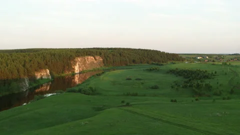 Aerial view of the river with a rock and forest on the banks Stock Footage 139190886