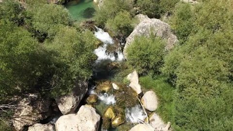 Aerial view of river rocks and trees 2 Stock Footage 294065293