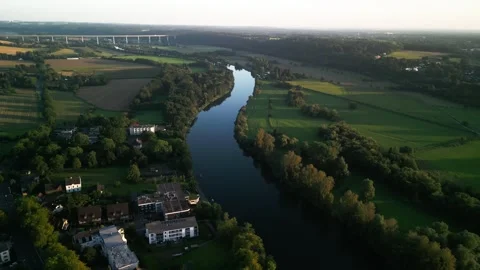 Aerial view of river running through green city landscape Stock Footage 248767704