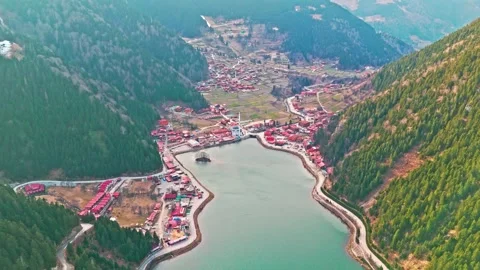 Aerial view of a river running through a valley with a town in the middle Stock Footage 267633058