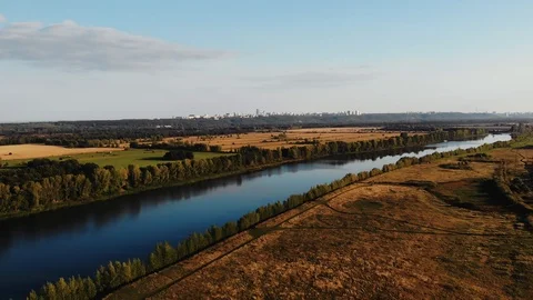 Aerial view of the river that separates nature from urban areas Stock Footage 107251428