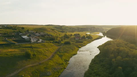 Aerial view of the river with smooth water and forest on the banks Stock Footage 139325181