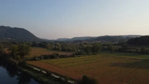Aerial view of a river at sunset with ducks and mountains Stock Footage 160685383