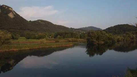 Aerial view of a river at sunset with ducks and mountains Stock Footage 160685578
