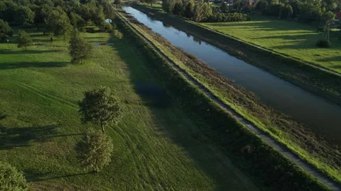 Aerial View of River Surrounded by Green Fields Video stock 291119221