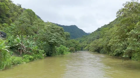 Aerial view of a river surrounded by lush green hills Stock-Footage 329828318