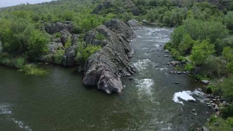 Aerial view of a river taking a hard corner in the rocky landscape. Video stock 149211877
