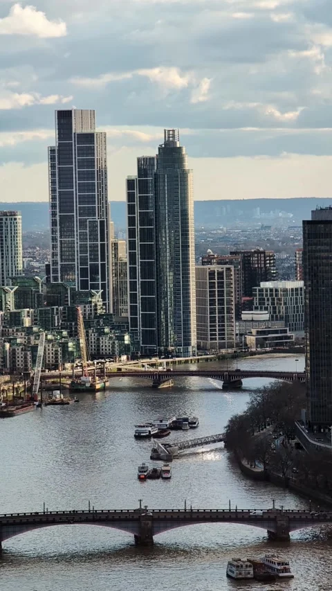 Aerial view of River Thames with boats and London financial district Video stock 335636749