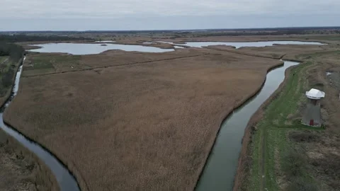 Aerial view of River Thurne joining Martham Broad #1(grd) Stock Footage 236410084