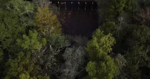 Aerial view of river, train tracks and lake at midday on an overcast day Stock Footage 162910559