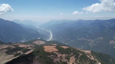 Aerial view of river valley between dry mountains in Xinjiang China Stock Footage 337674954