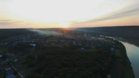 Aerial view of a river in the valley during smoke covered sky from forest fires. Stock Footage 128280418