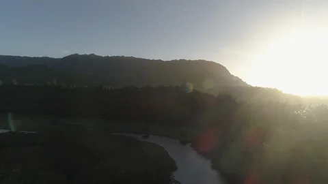 Aerial View of River in Valley at Sunset in Kauai, Hawaii Stock Footage 125792855