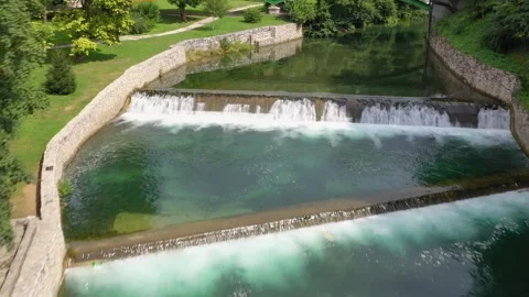 Aerial view of river weir creating calm water basin Stock Footage 324712051