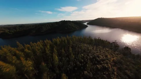 Aerial view of river winding through forested hills at Alcacer do Sal Video stock 342189209