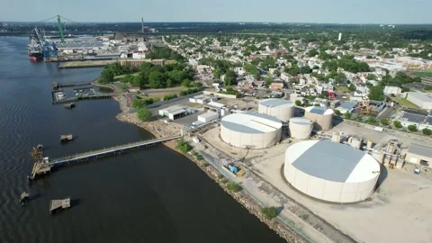 Aerial View of a Riverfront Refinery Stock Footage 163780373