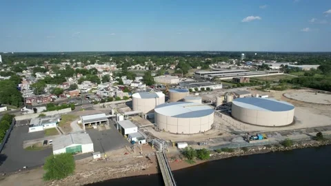 Aerial View of a Riverfront Refinery Stock Footage 163780383