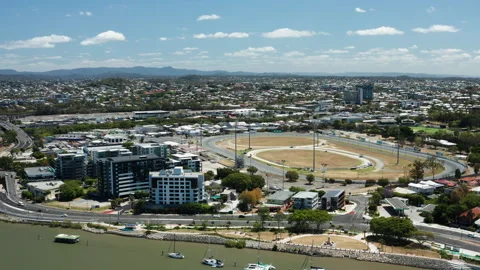 Aerial View of Riverfront Suburb with Eagle Farm Racecourse Oval Stock Footage 310553828