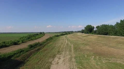 Aerial view of riverside field Stock Footage 50756416