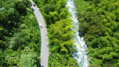 Aerial View of Road Alongside River, Scenic Drive Through Landscape Stock Footage 306784185