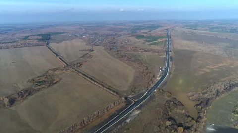 Aerial view of a road amid fields Stock Footage 99249963