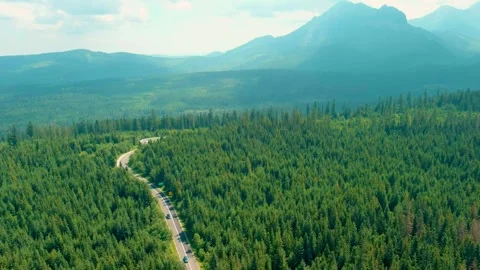Aerial view of the road and cloudy Tatras mountains near the town of Zakopane, Stock Footage 282448446
