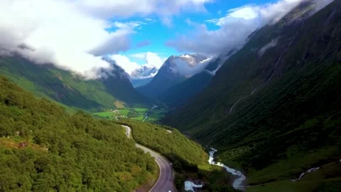 Aerial view of road and river through a Norwegian mountain valley Stock-Footage 341328764