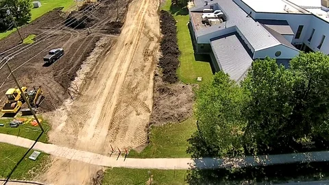 Aerial view of a road being constructed in Portage la Prairie Manitoba. Stock Footage 92589653