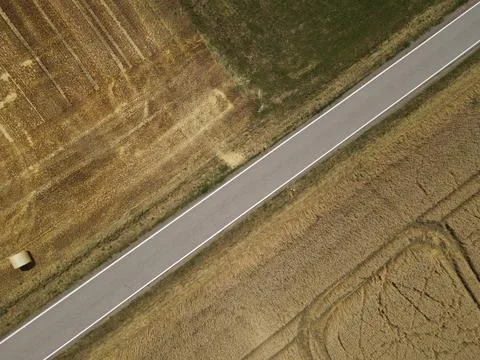 Aerial view of a road between fields in the countryside Stock Photos