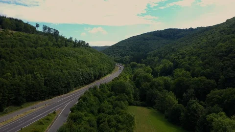 Aerial view of road between forest in Germany Stock Footage 127658346
