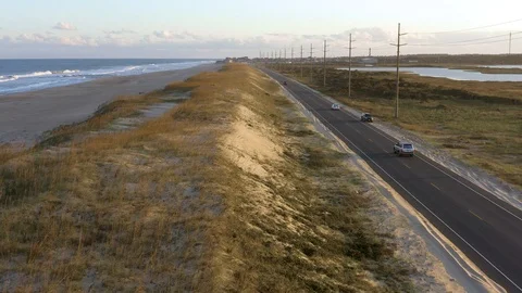 Aerial view of road between ocean side and sound side. 4k Stock Footage 104608552