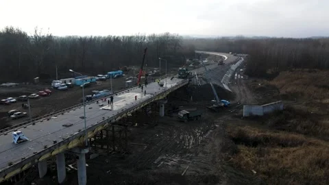 Aerial view of a road bridge under construction. road and bridge under Stock Footage 229436361