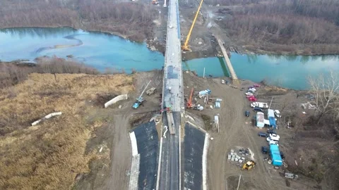 Aerial view of a road bridge under construction. road and bridge under Stock Footage 231075784