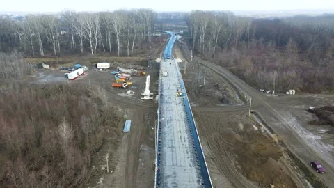 Aerial view of a road bridge under construction. road and bridge under Stock Footage 231260635