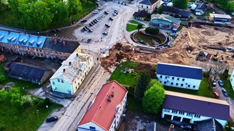 Aerial view of road construction and urban development in a small European town Stock Footage 340884240